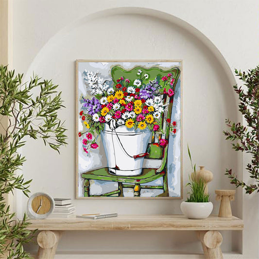 A Bucket of Daisy Flowers on a Chair