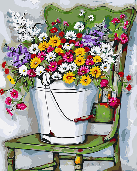 A Bucket of Daisy Flowers on a Chair